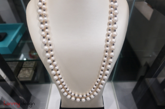 White double strand pearl necklace with black gem 